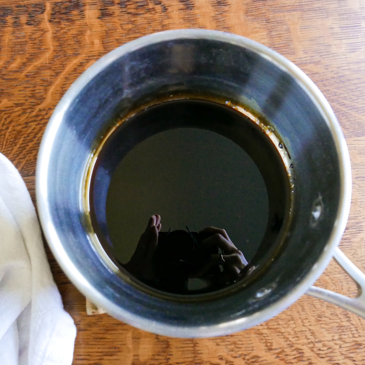 Balsamic reduction in a small pot.