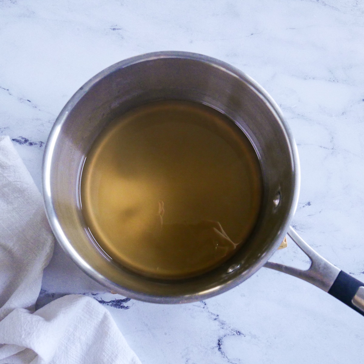 Ingredients whisked together in a sauce pan.