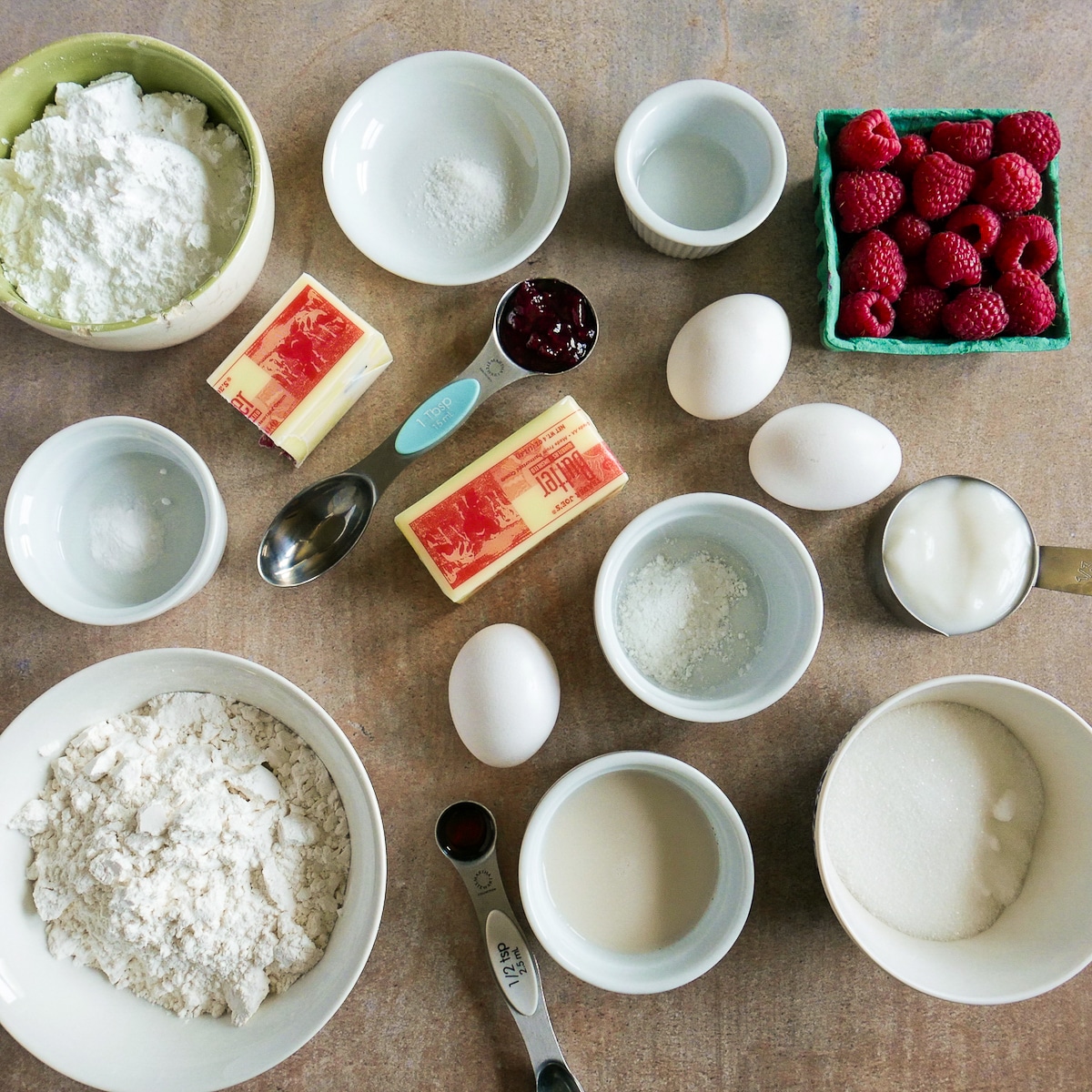 Cupcake recipe ingredients arranged on a table.