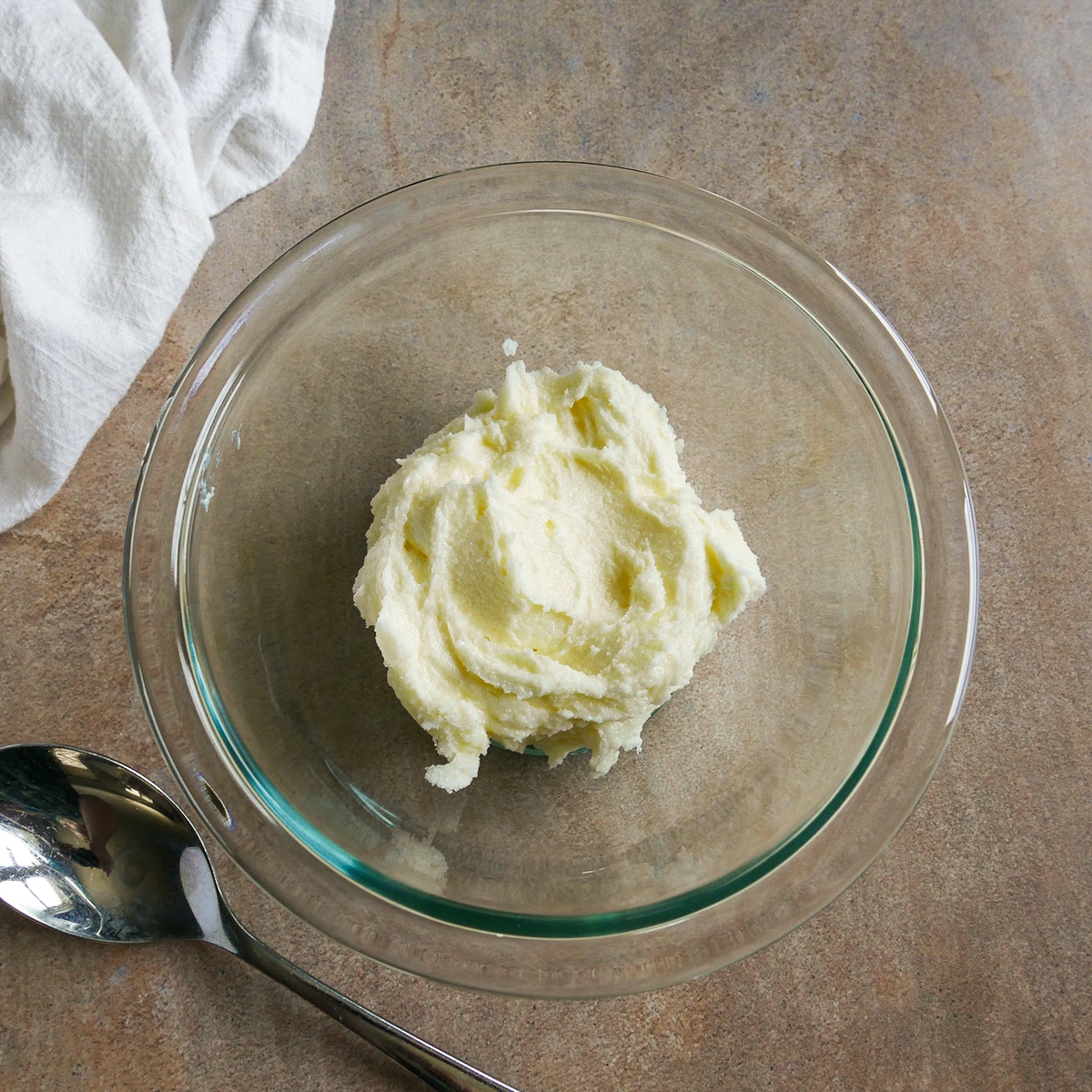 Beaten butter and sugar in a mixing bowl.