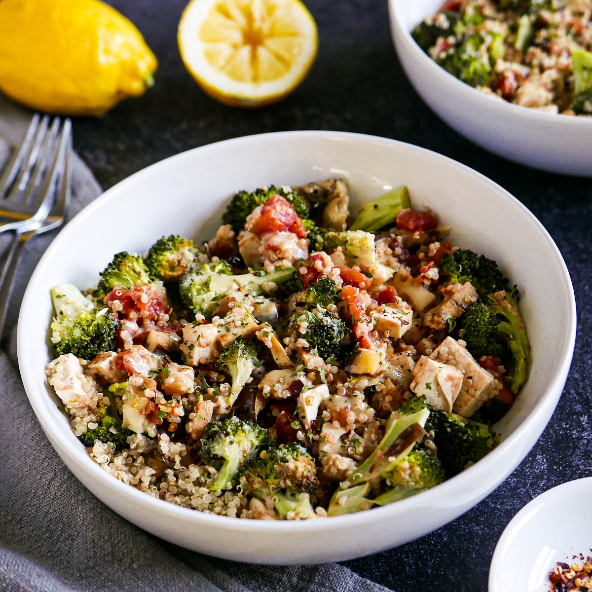 assembled-quinoa-bowl.jpg Assembled vegan quinoa bowl with two forks and napkin on the side.