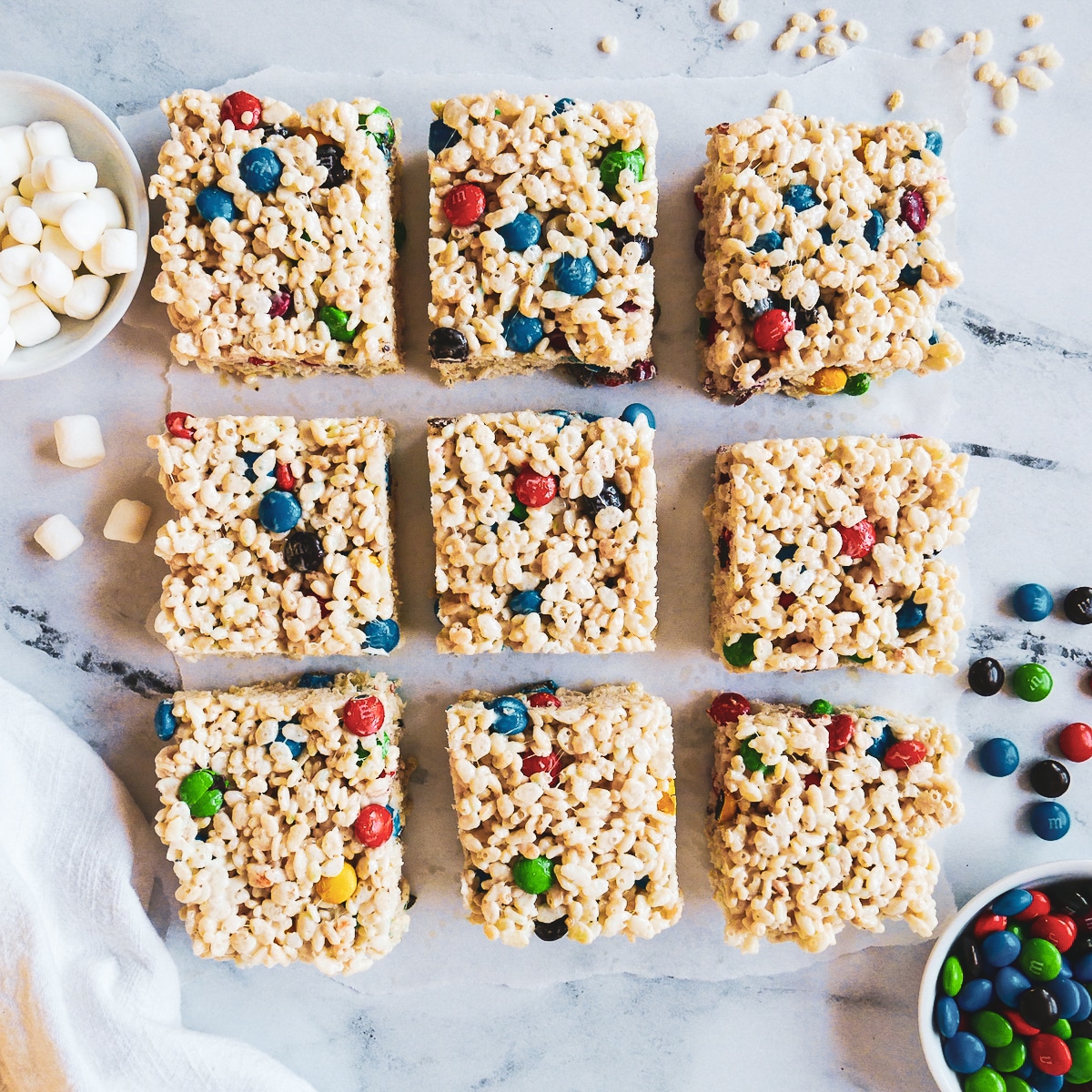 rice krispie bars cut into nine squares and arranged in a grid pattern. 