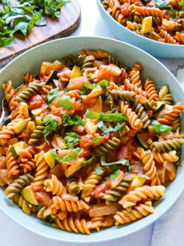 one pot vegetarian pasta in a large bowl with spoon.