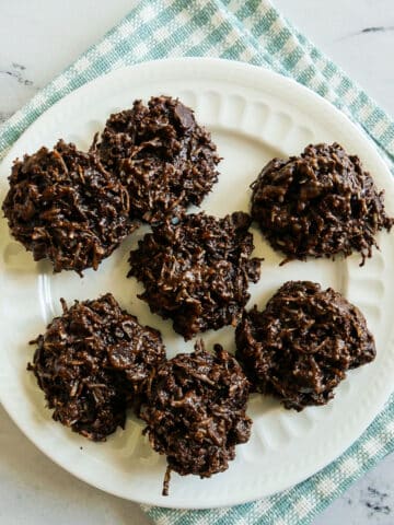 plate of macaroons on a gingham napkin.