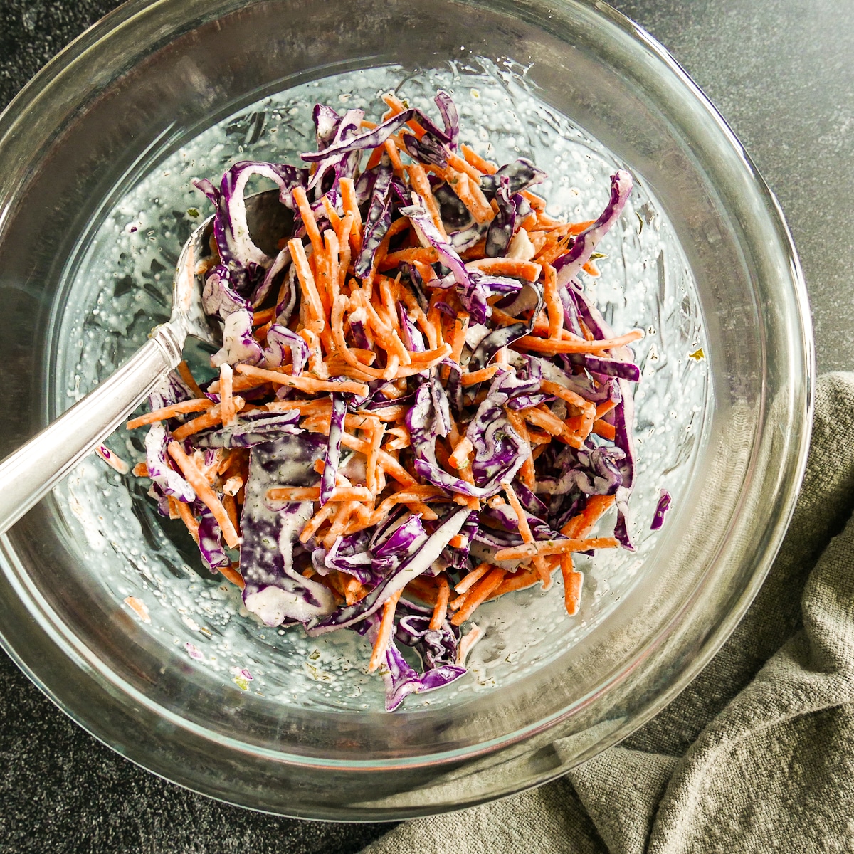 Ranch slaw mixed together in a mixing bowl.