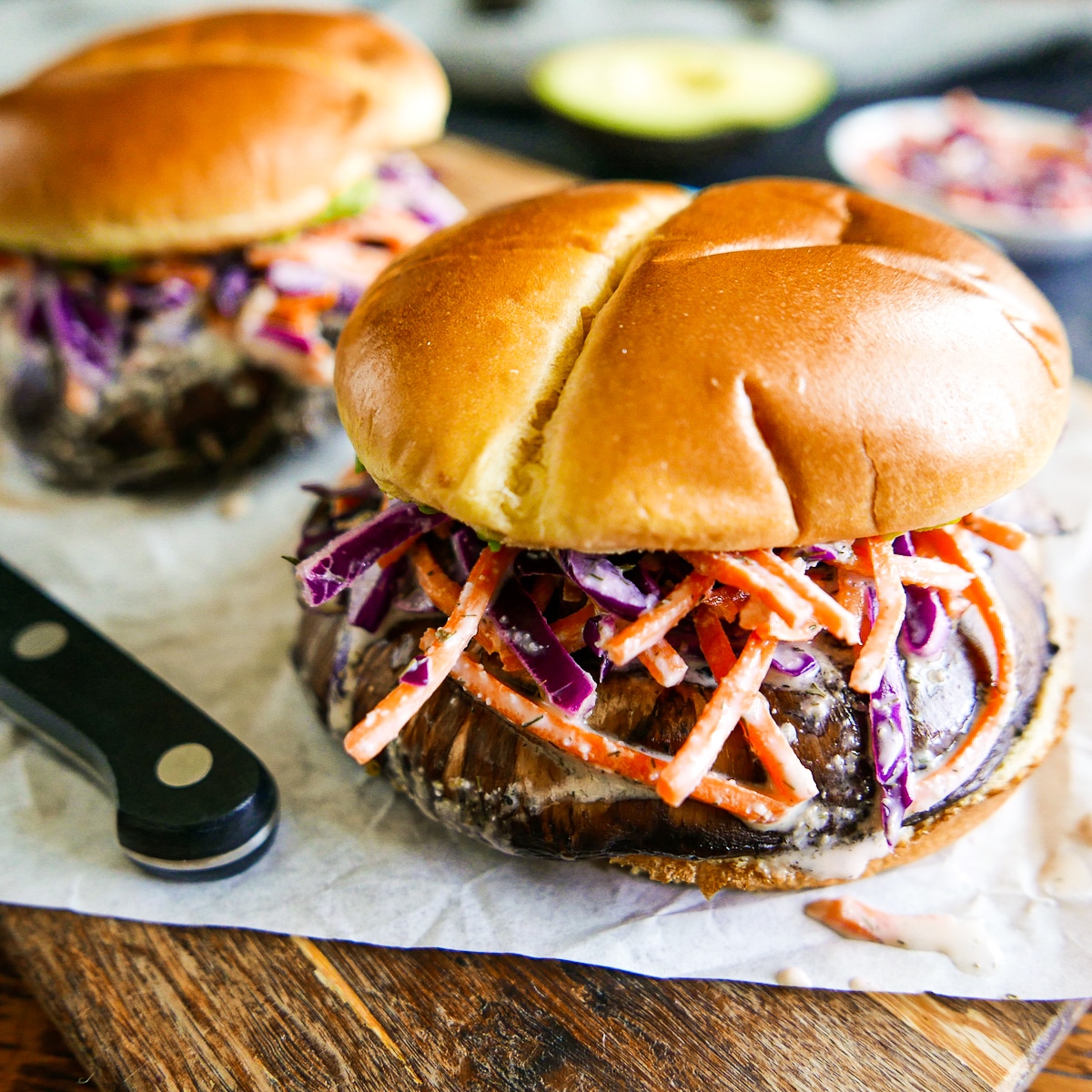 mushroom-sandwiches.jpg portobello mushroom sandwiches arranged on a cutting board.