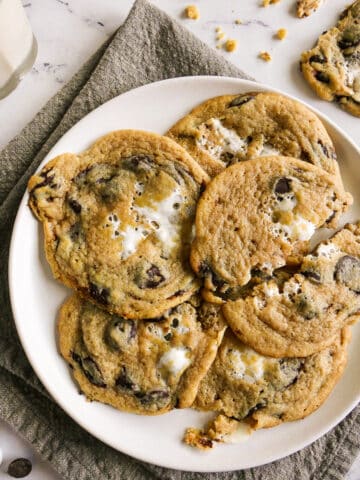 marshmallow chocolate chip cookies arranged on a white plate.