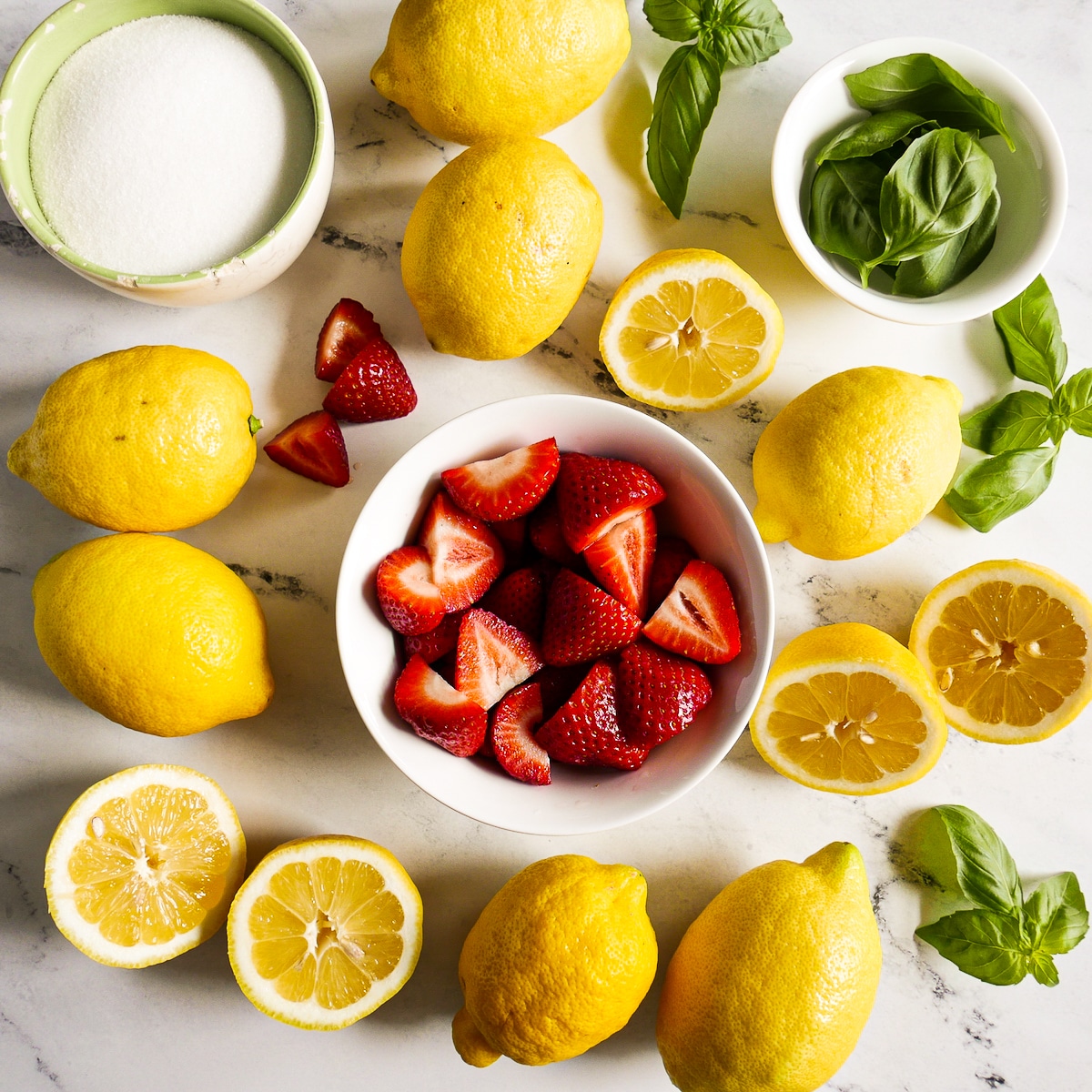 Lemonade ingredients arranged on a table.