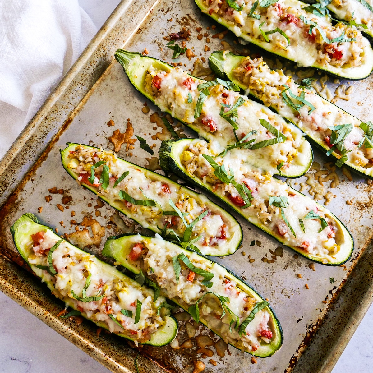 baked-zucchini-boats.jpg Baked zucchini boats on a baking sheet.