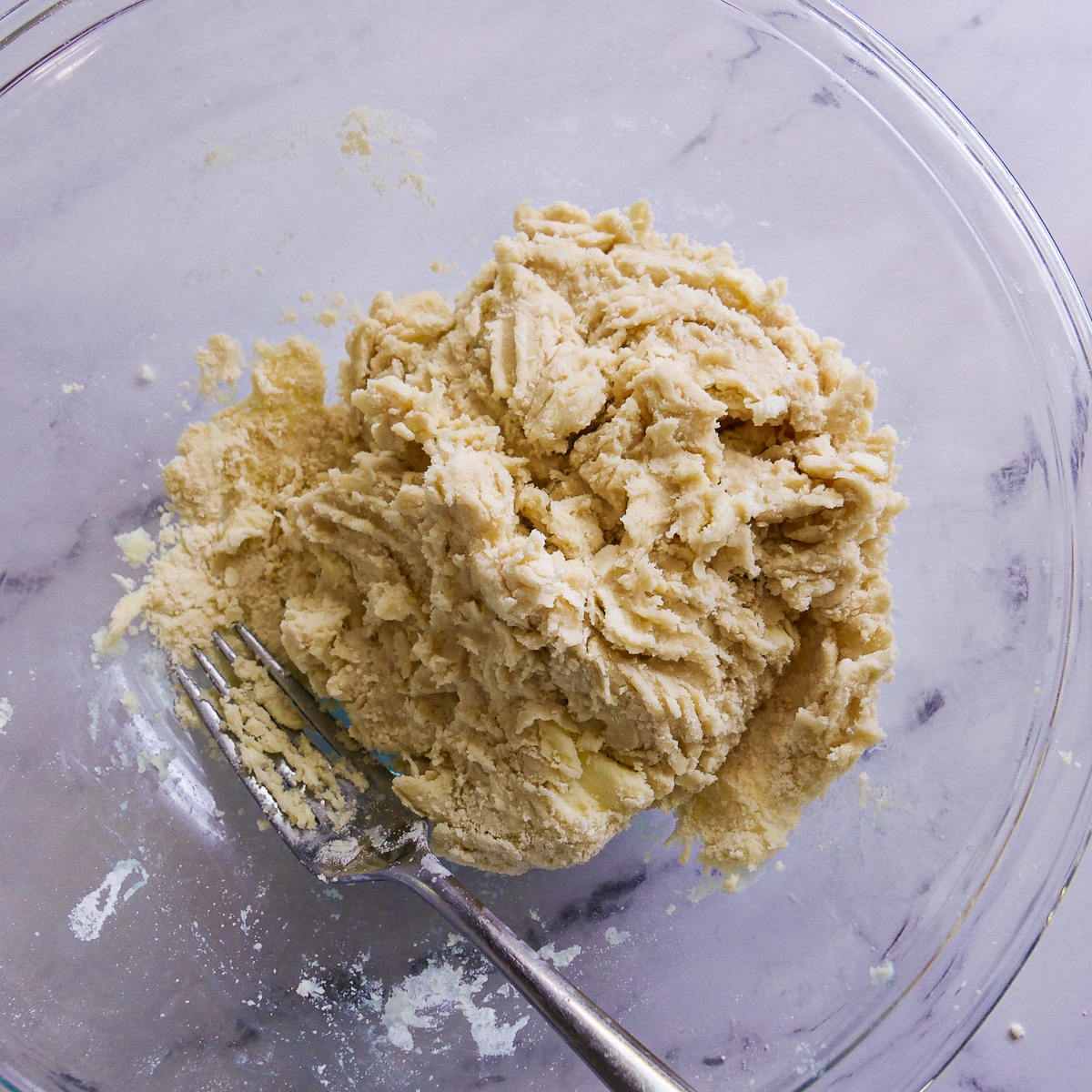 galette-dough.jpg Cohesive galette dough in a mixing bowl with a fork.