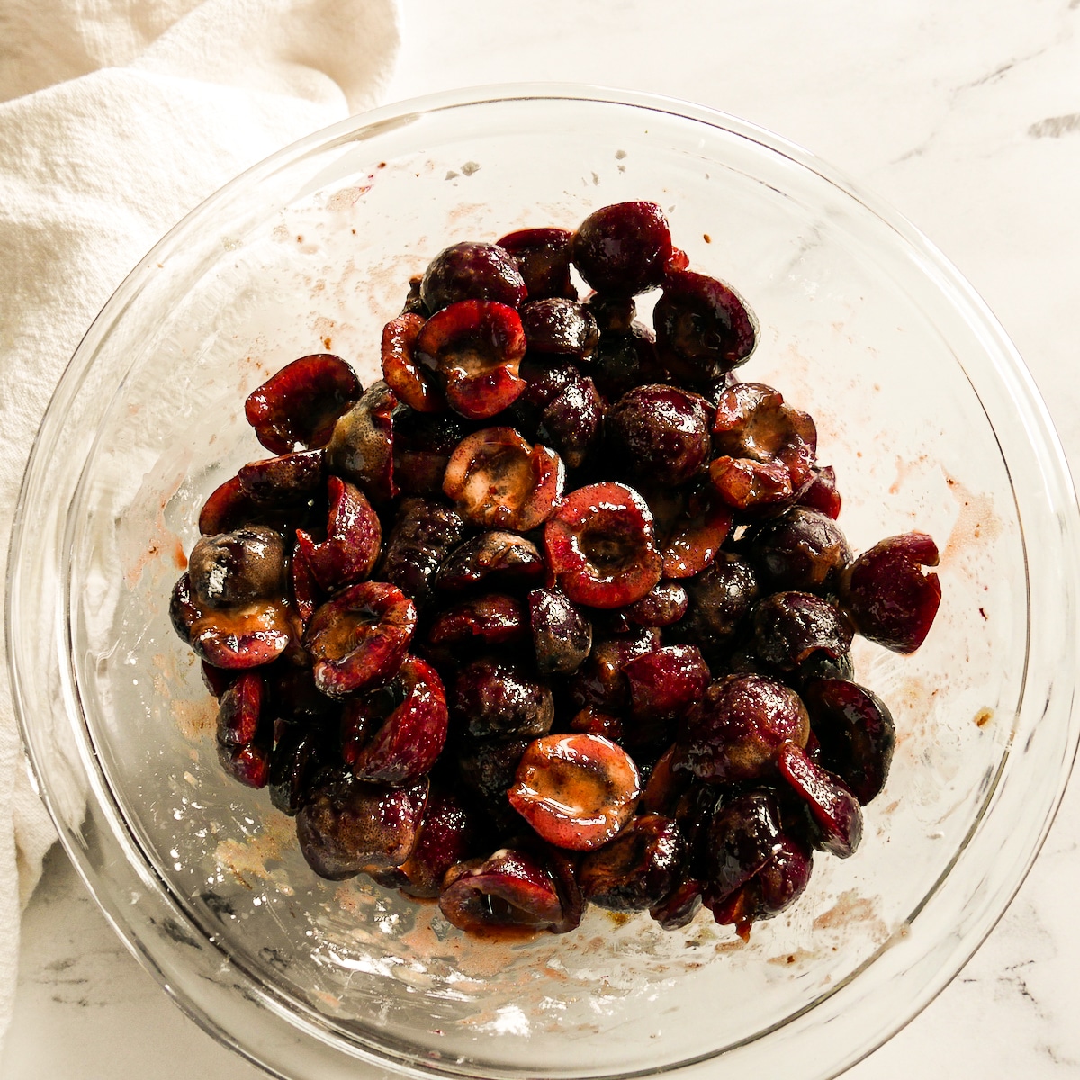 cherries-tossed-with-ingredients.jpg Stemmed, pitted, and halved cherries tossed with filling ingredients.