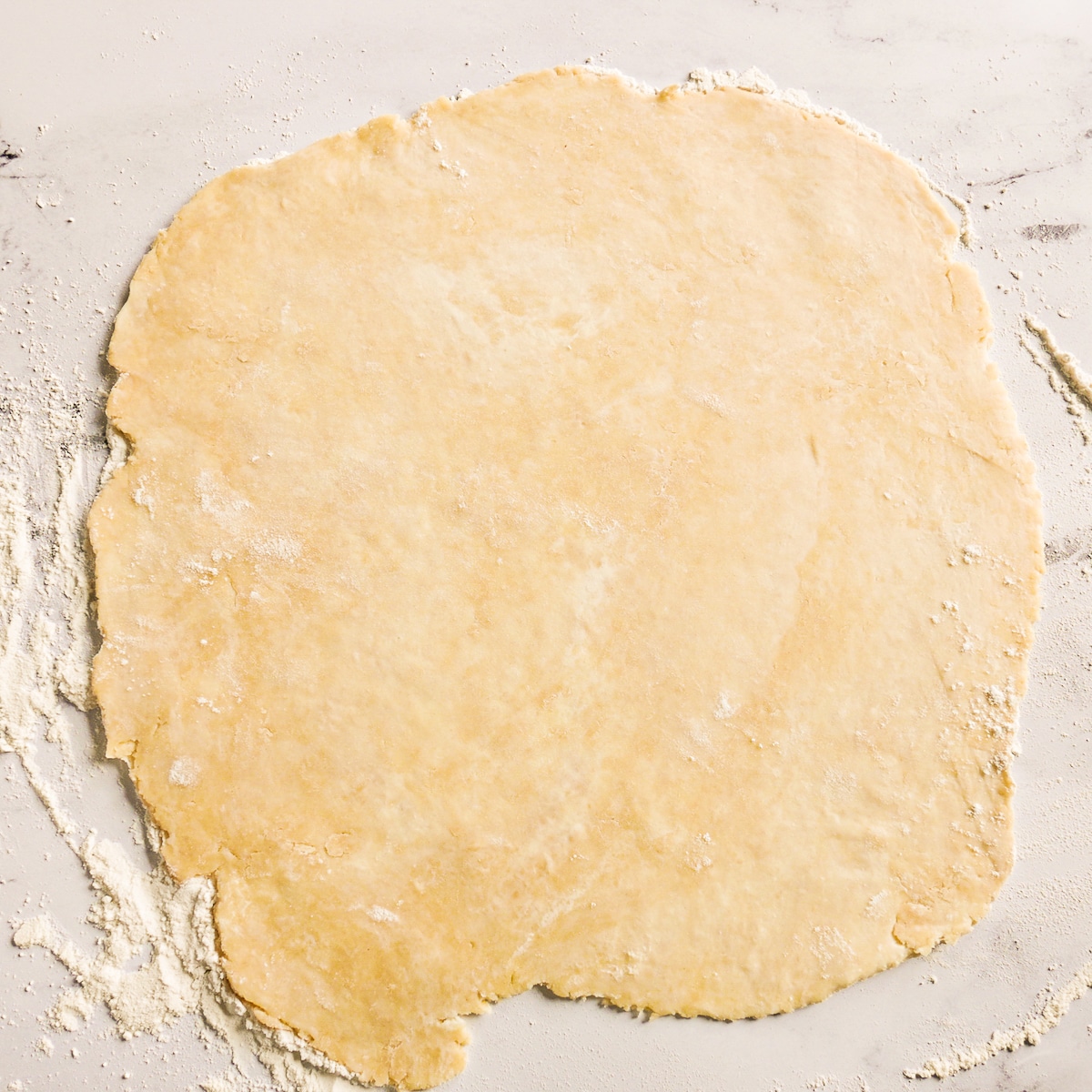 rolled-out-dough.jpg Galette dough rolled out into a 12" diameter circle.
