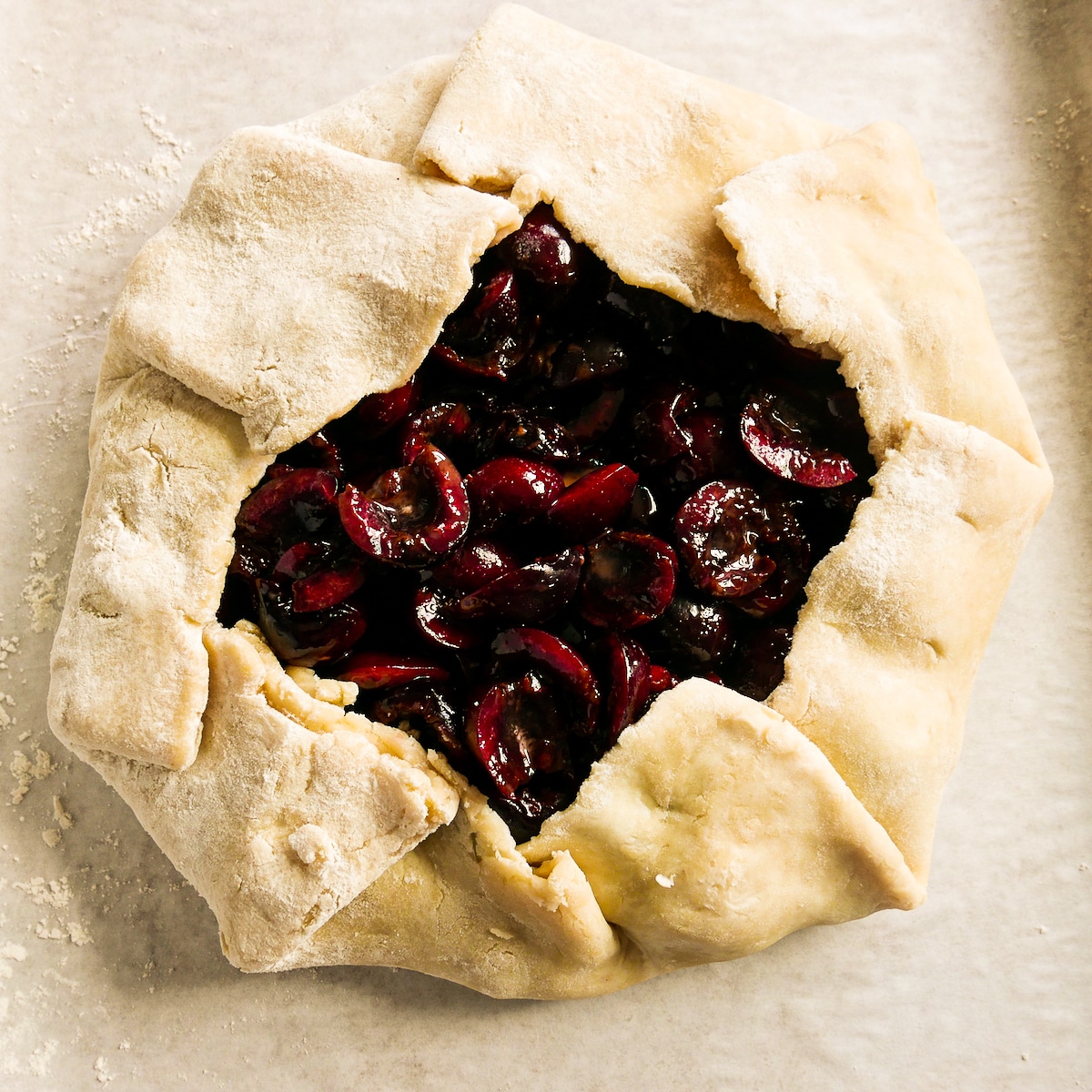 assembled-galette.jpg Sides of galette folded up over sides of cherry filling.