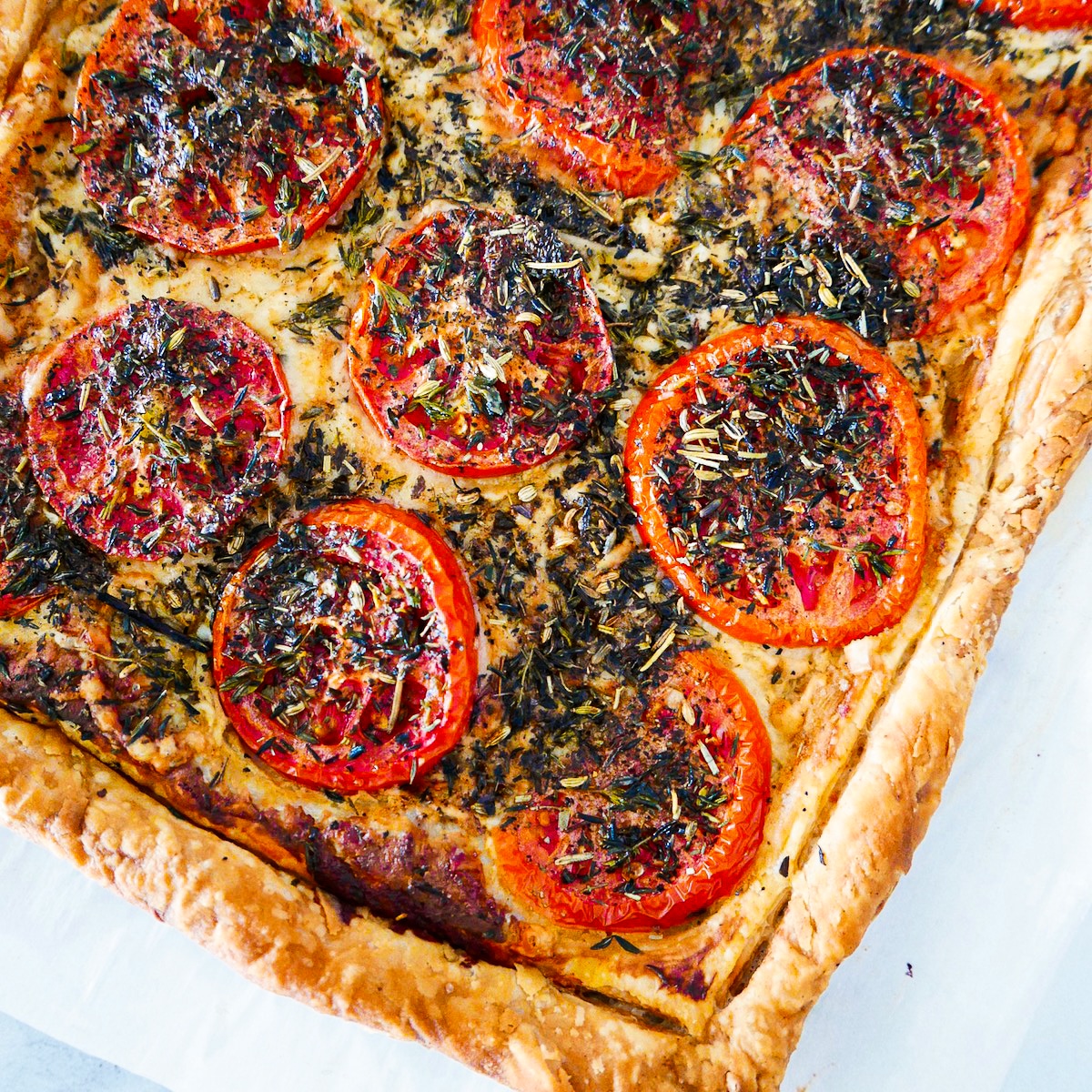golden-brown-tart.jpg Golden brown puff pastry tart on a baking sheet.