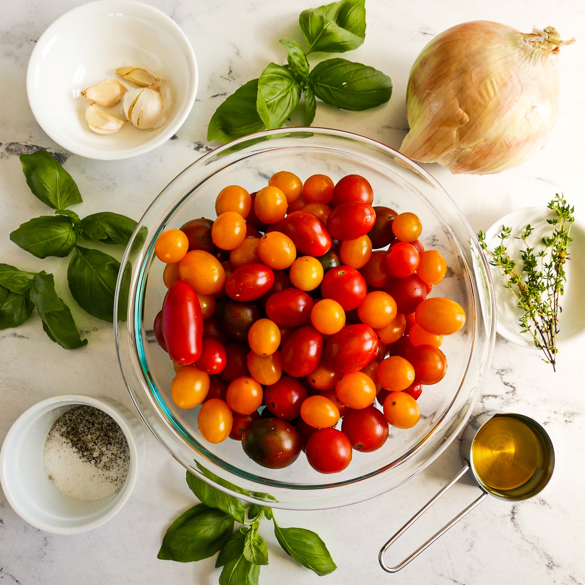 Tomato sauce recipe ingredients arranged on a table.