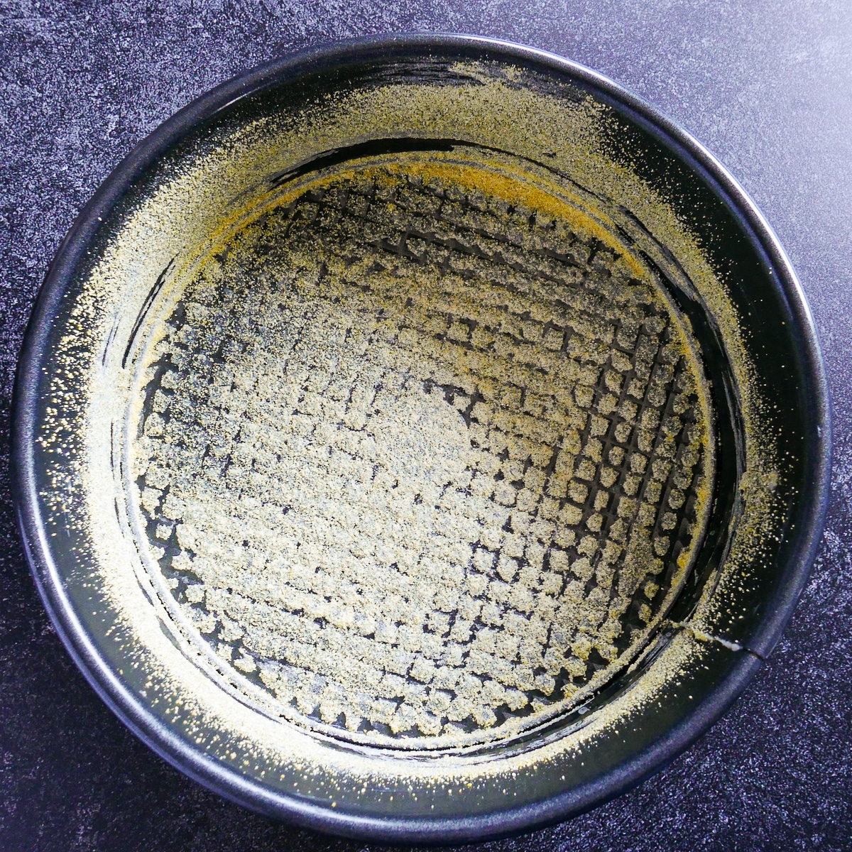 prepped-pan.jpg Prepped springform pan greased with butter and dusted with cornmeal.