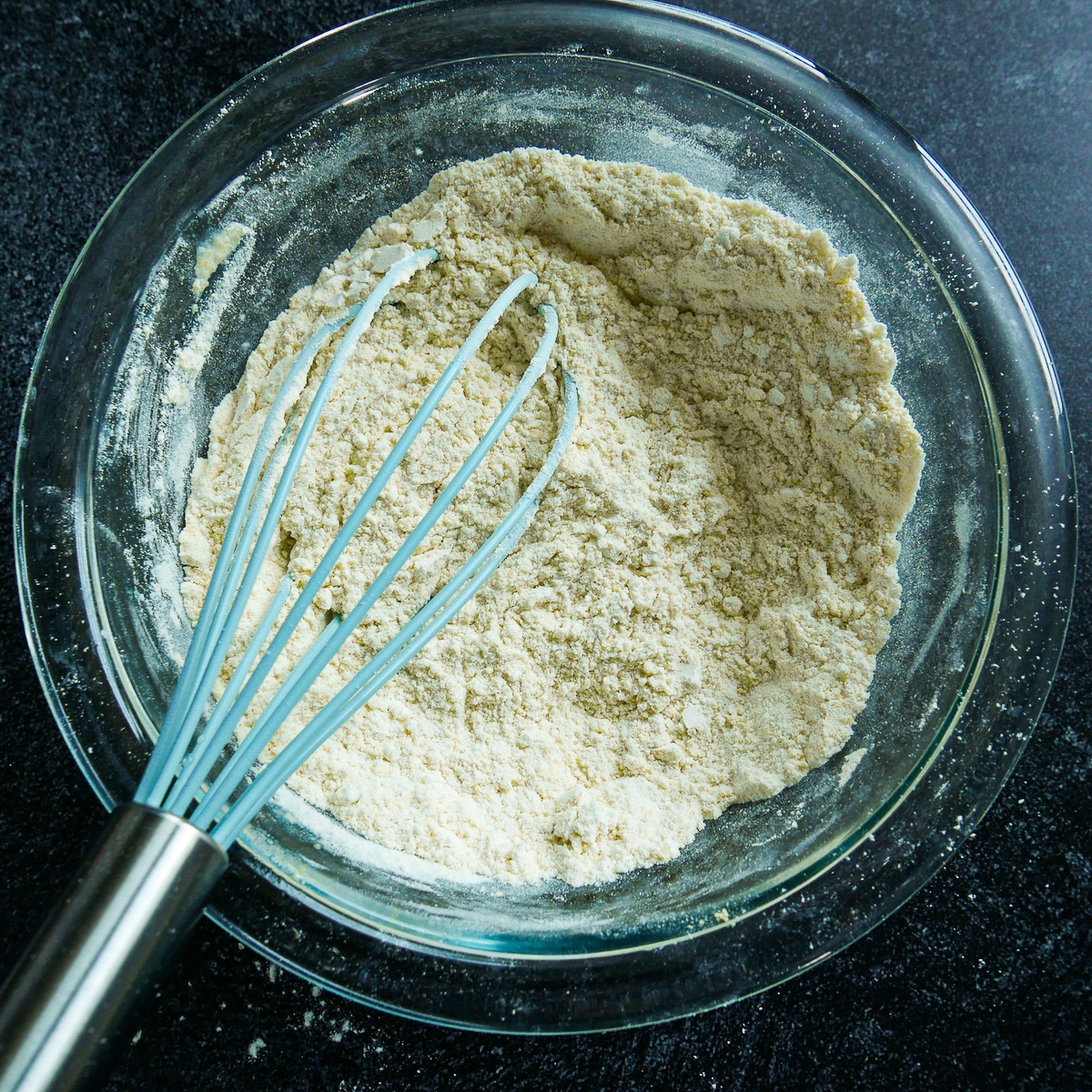 whisked-dry-ingredients.jpg Dry ingredients whisked together in a glass bowl.