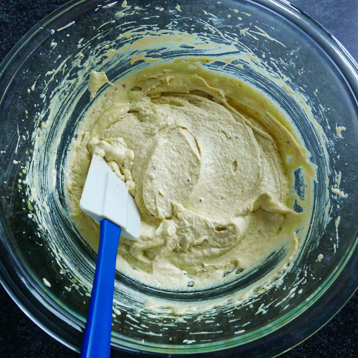 eggs-added-to-batter.jpg Two eggs combined into butter and sugar mixture.