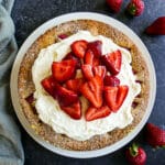 Strawberry buttermilk cake topped with whipped cream and strawberries.