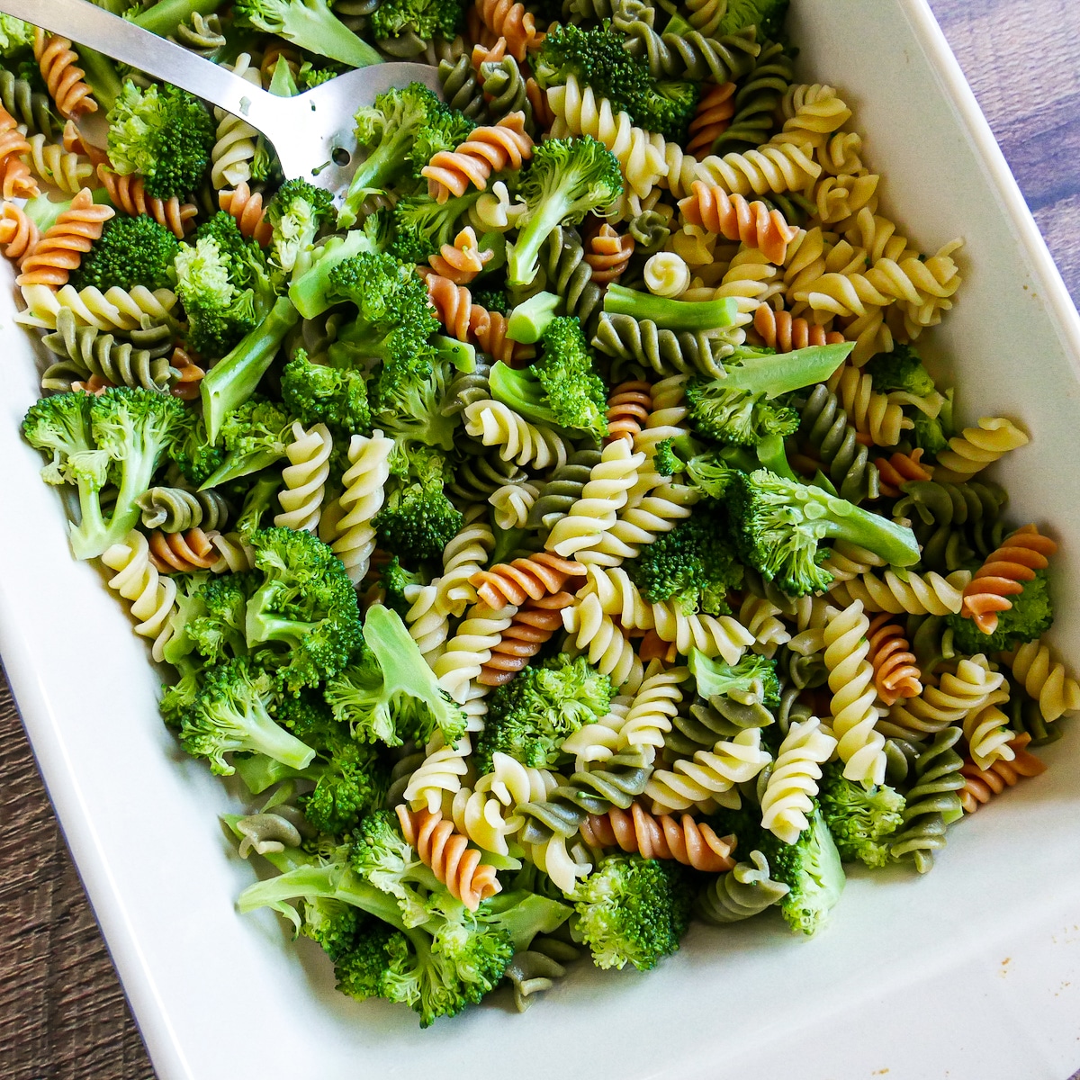 Cooked pasta and broccoli drained and placed into a large baking dish.