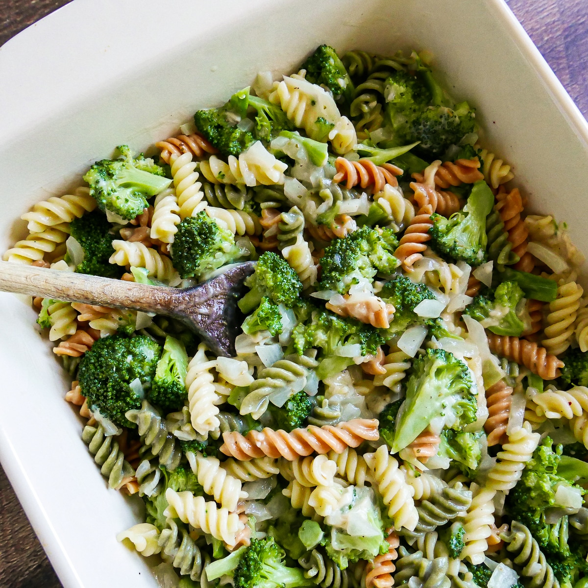 Sauce mixture added to cooked pasta and broccoli and mixed together.