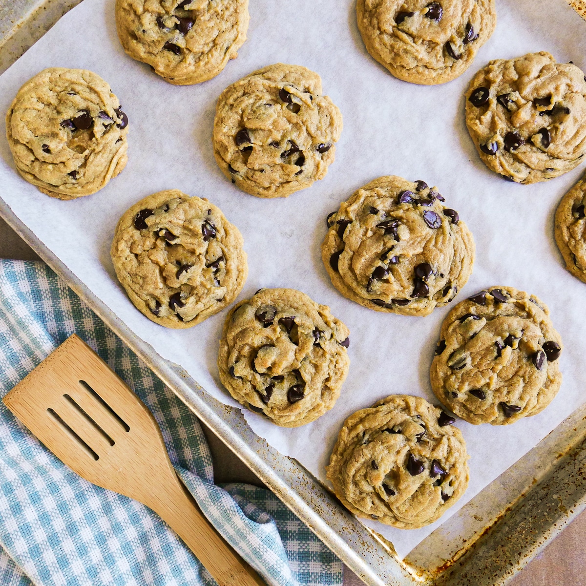 baked-cookies.jpg Lactose free cookies cooling on a baking sheet with spatula next to it.