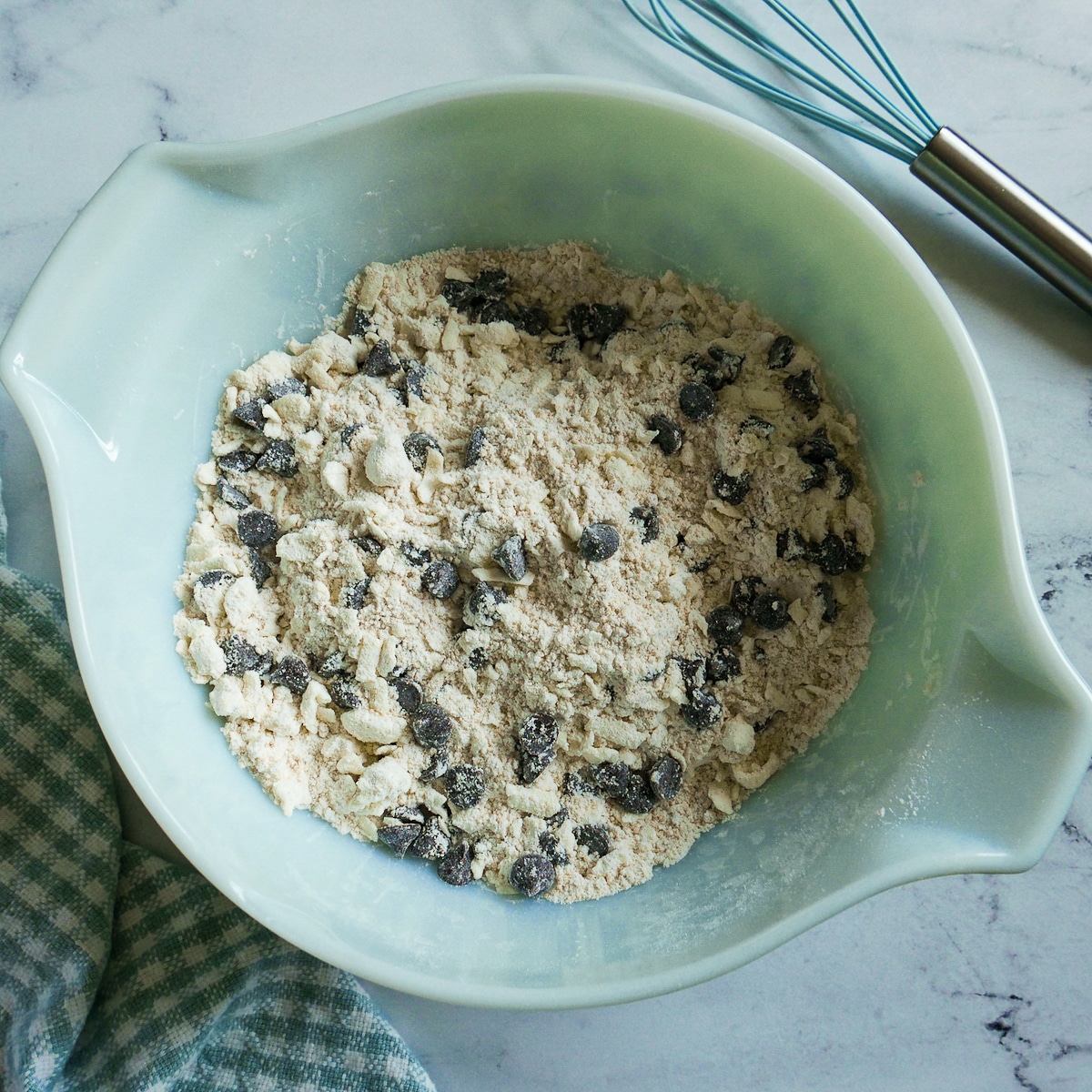 chocolate chips stirred into flour and butter mixture.