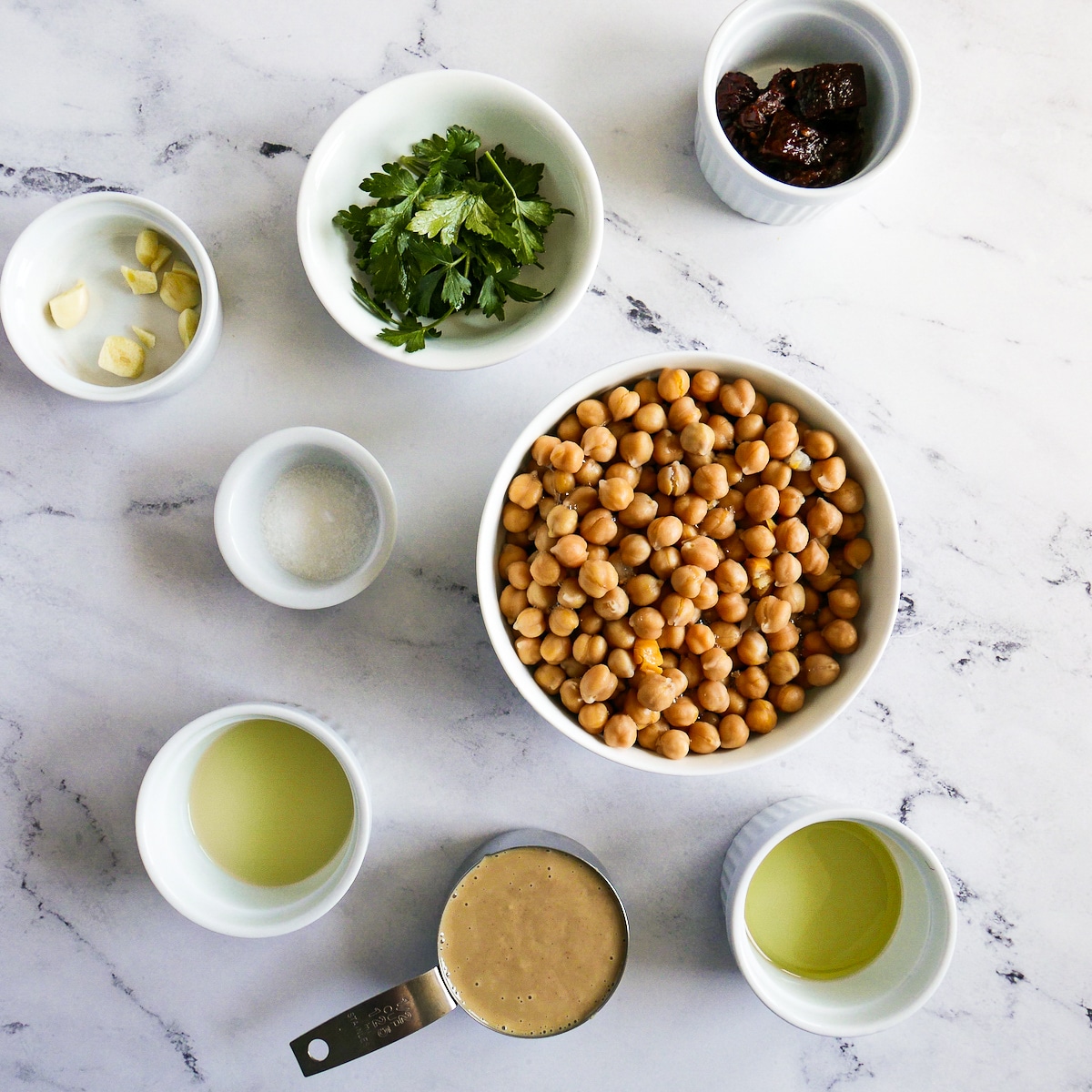 Hummus ingredients arranged on a table.