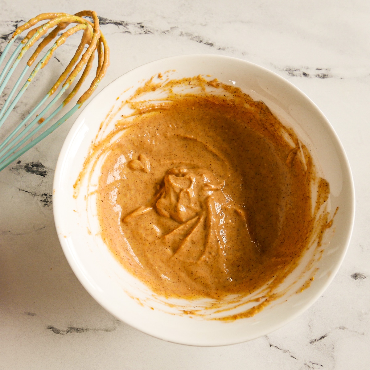 Pumpkin swirl ingredients mixed together in a small bowl.