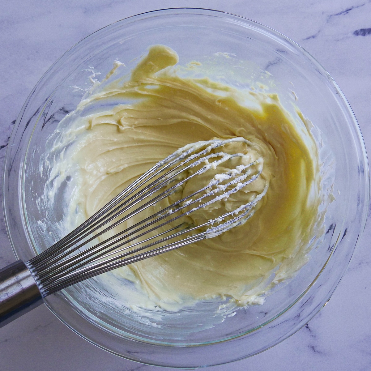cream-cheese-mixture.jpg Cream cheese swirl mixed together in a medium bowl.
