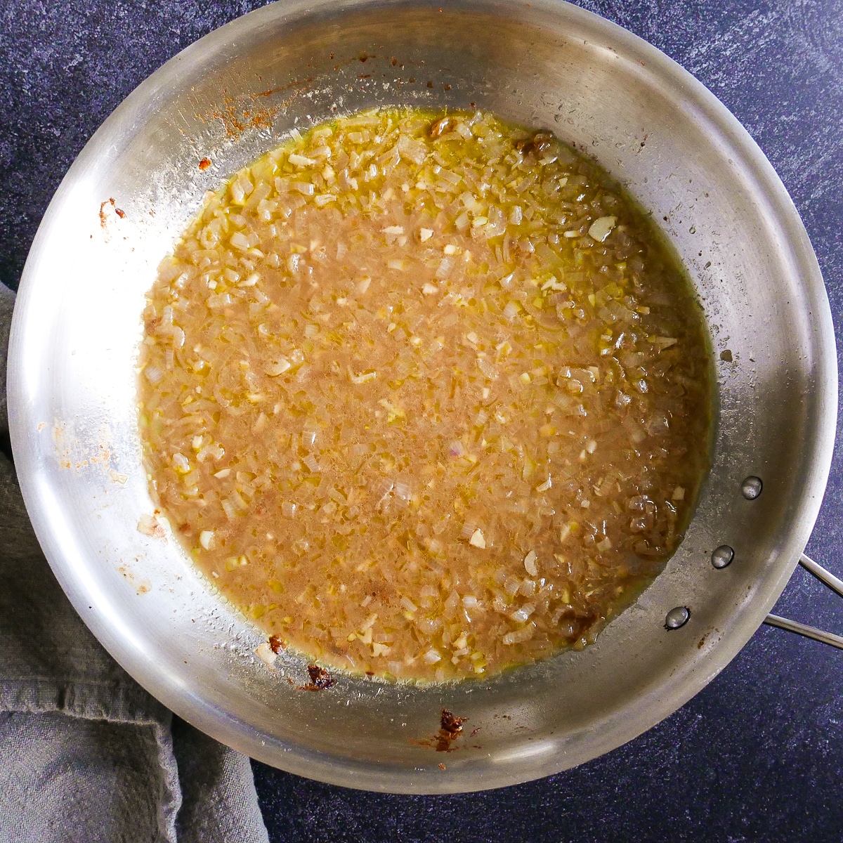 Deglazing pan with white wine and vegetable broth.