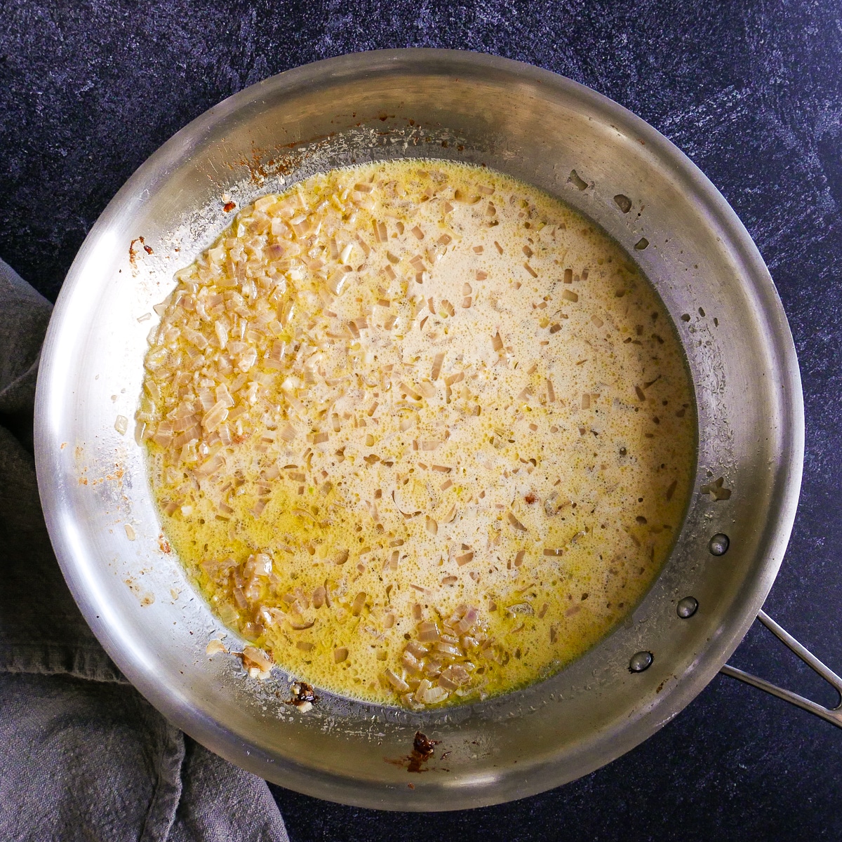 Heavy cream added to garlic wine pasta sauce.