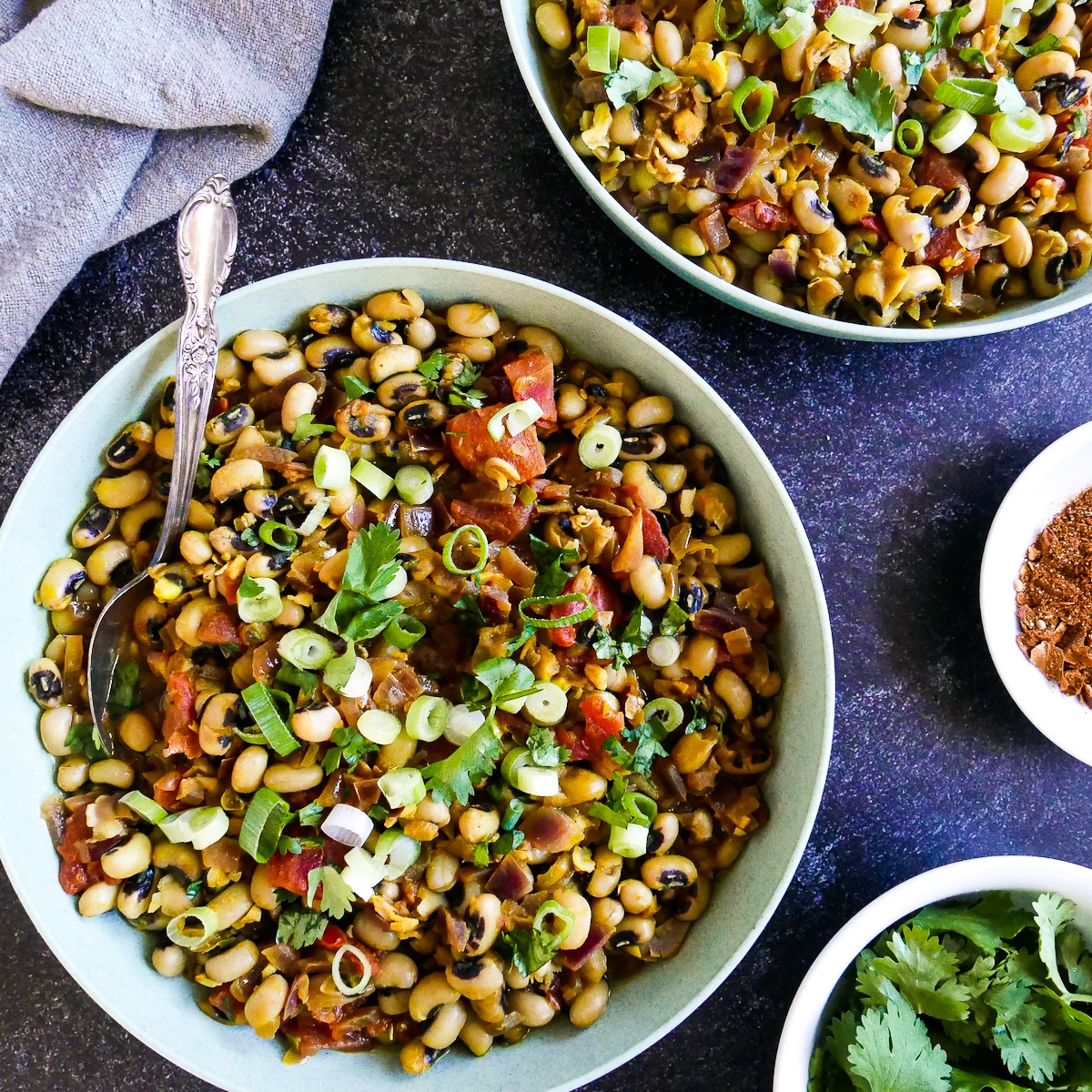 Black eyed peas garnished with scallions and cilantro.