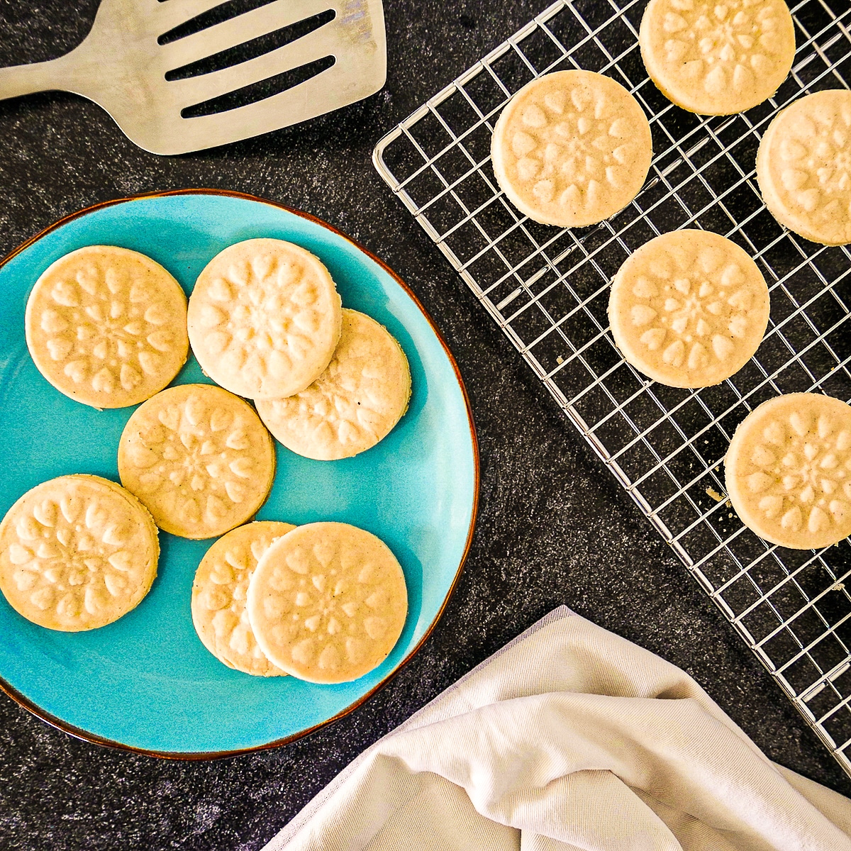 Soft and tender cardamom cookies arranged on a cooling rack. 