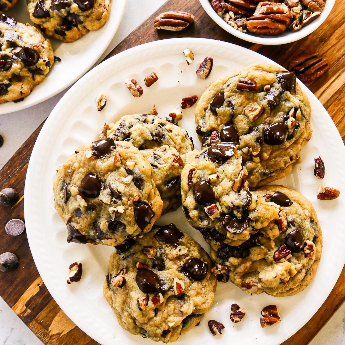 plate of chewy pecan chocolate cookies with chopped pecans.