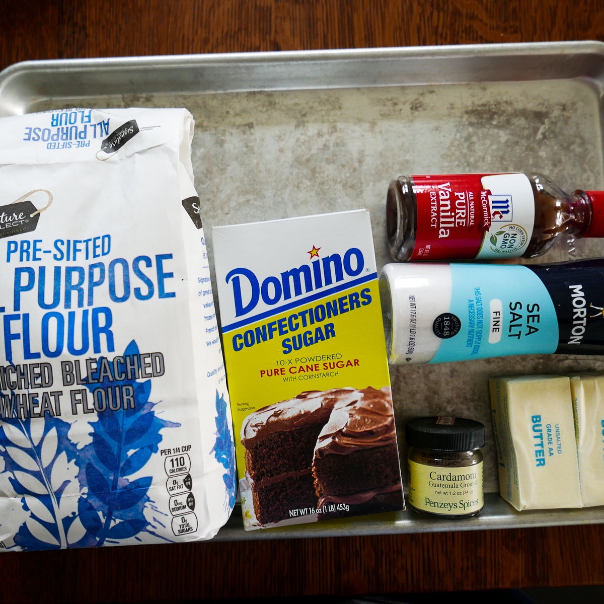 Cookie ingredients arranged on a baking sheet.