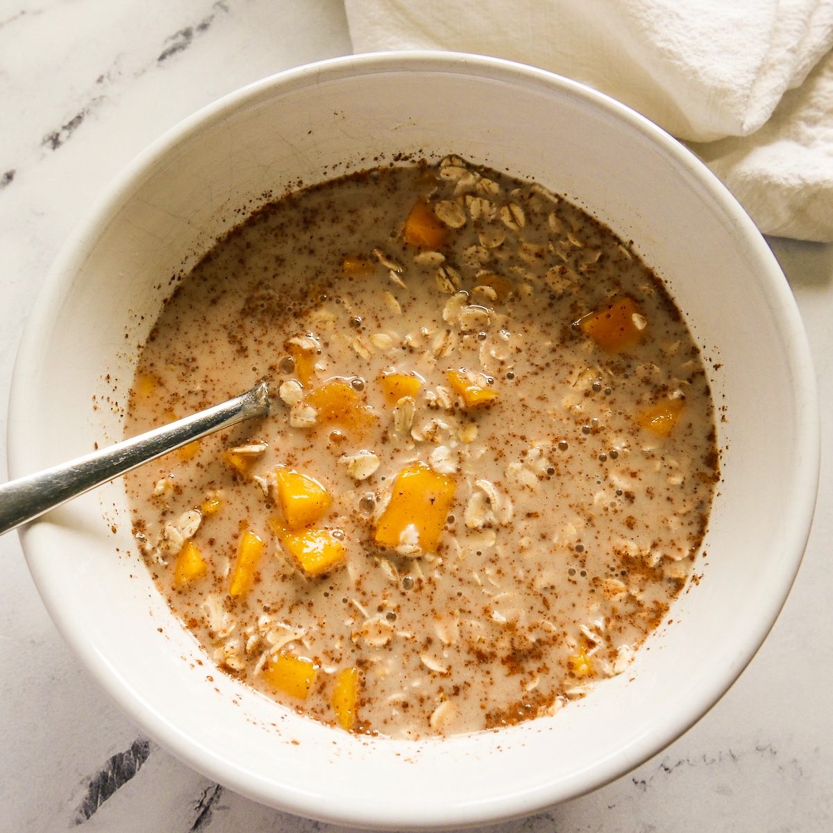 Making overnight oats in a bowl.