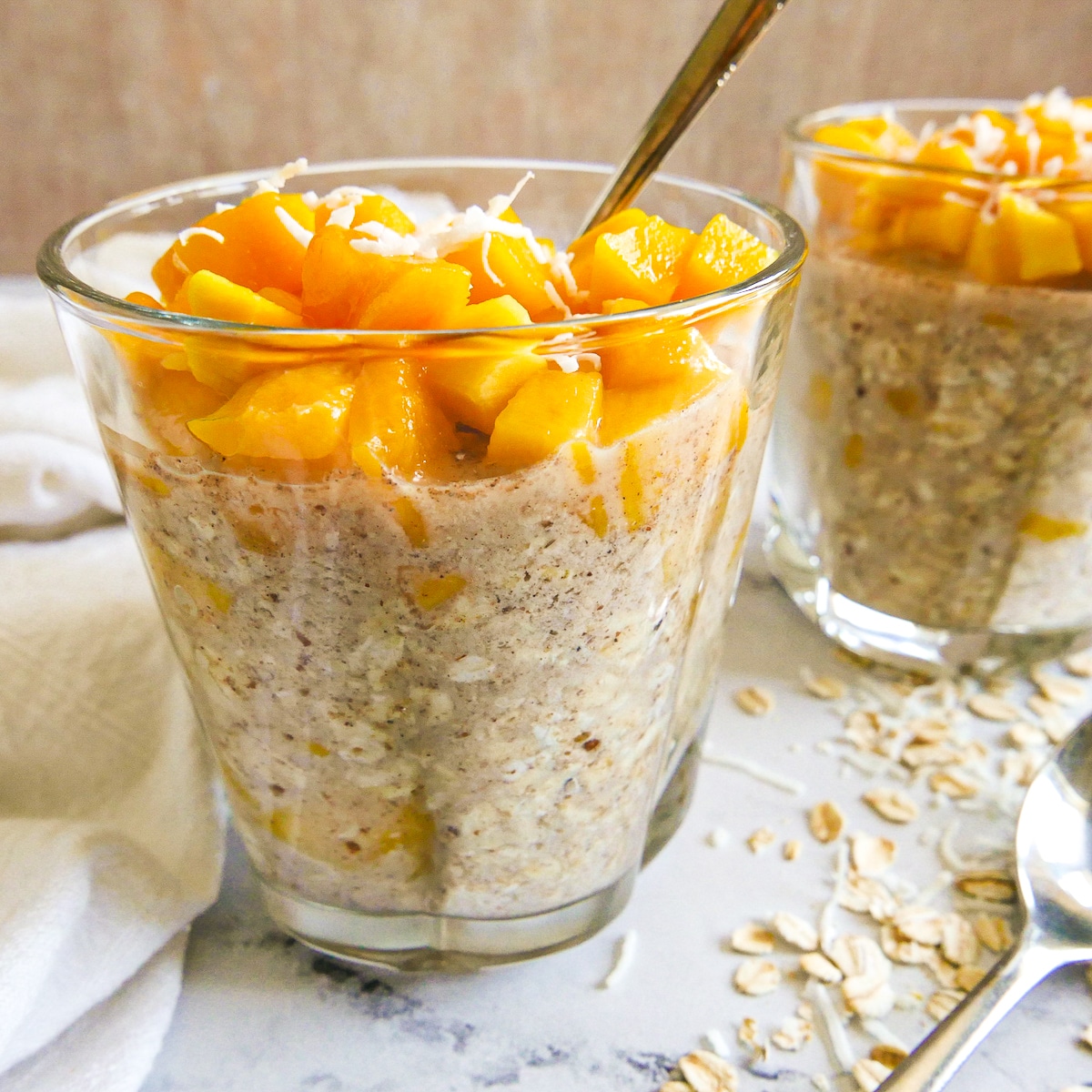 Dairy free overnight oats topped with mango.