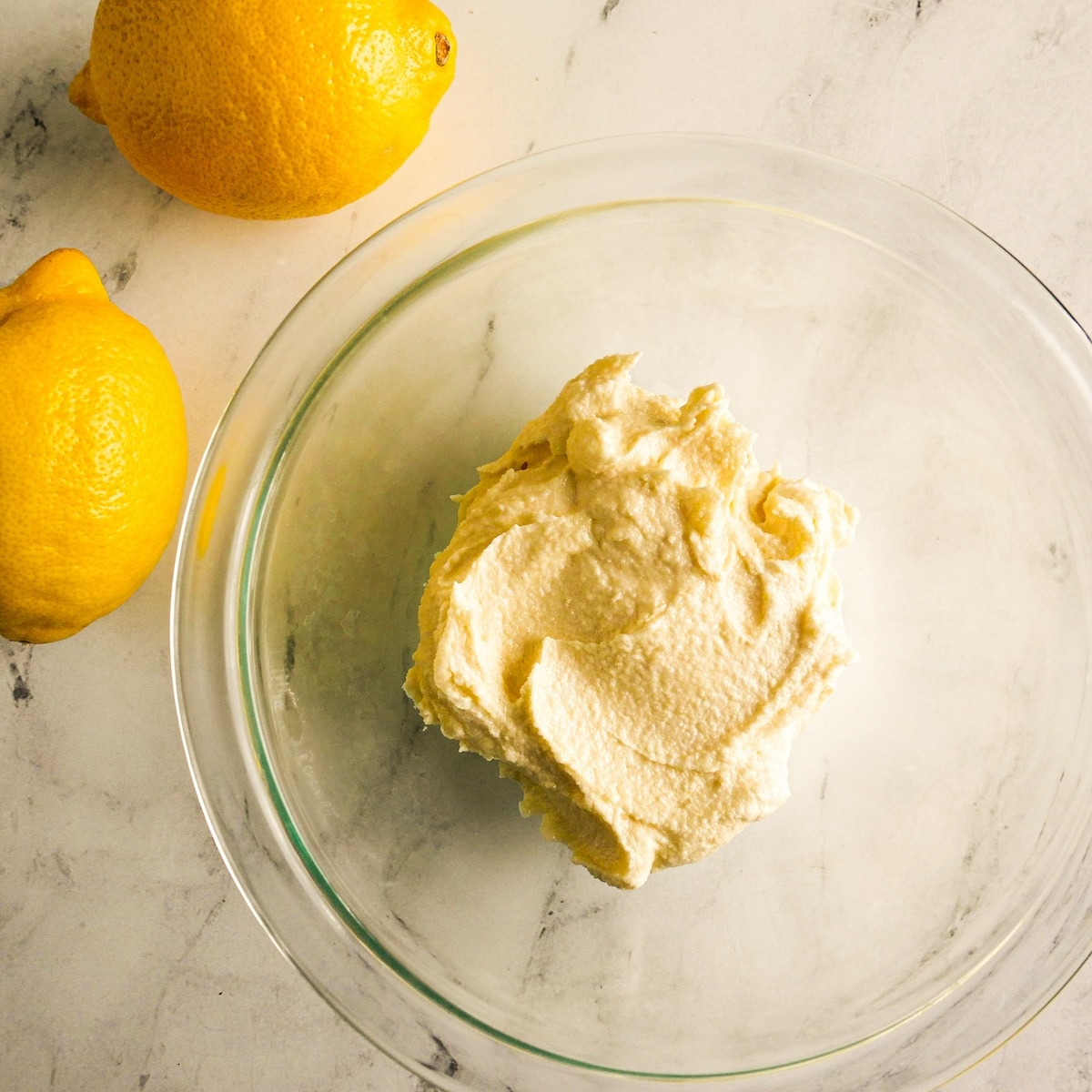 Vegan butter and sugar creamed together in a bowl.