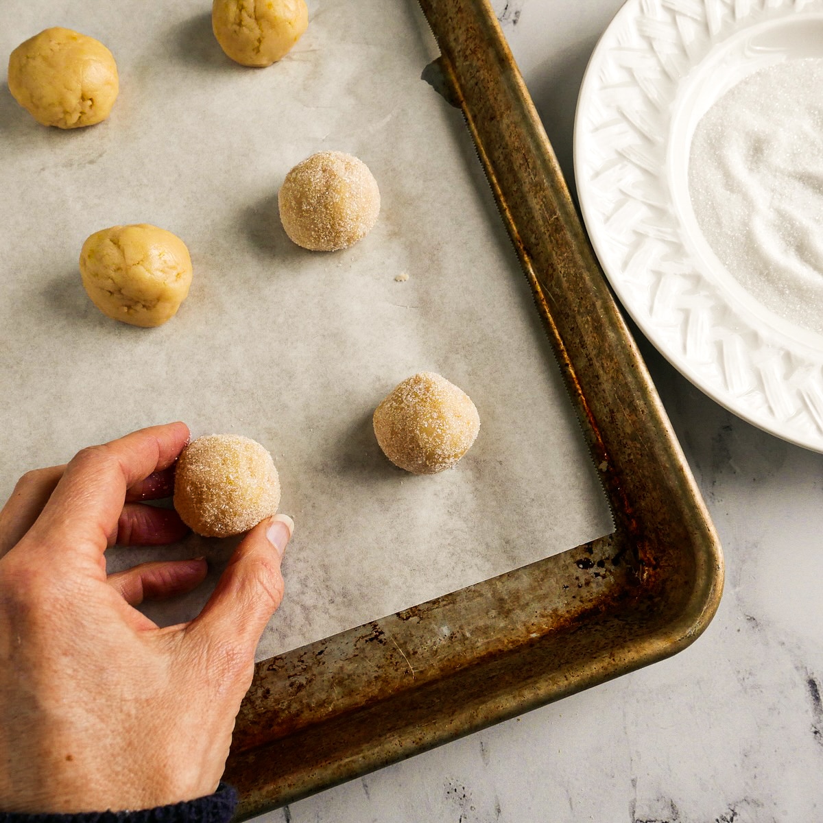 Cookie dough rolled into balls and dipped into granulated sugar. 