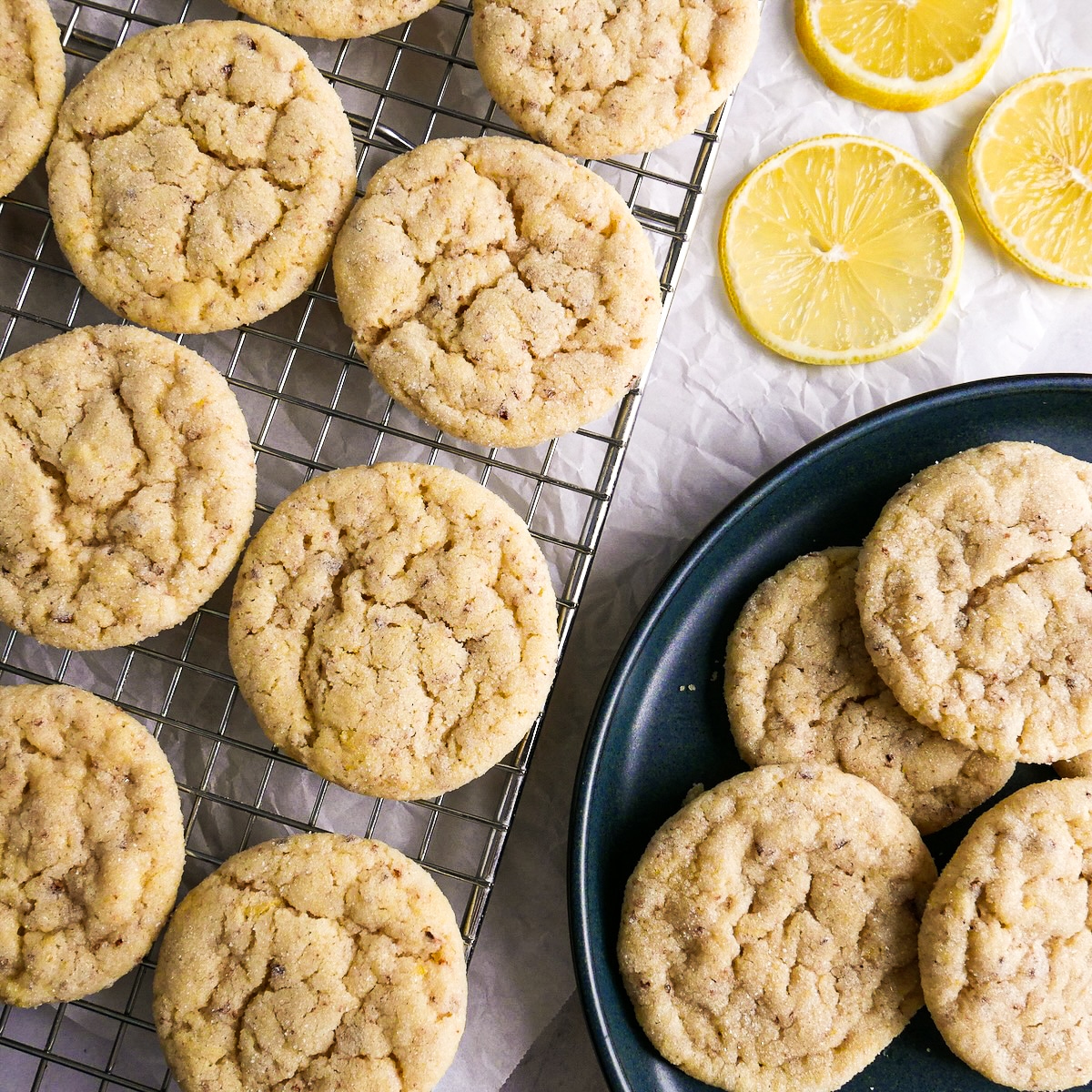 Chewy lemon cookies cooling on a wire rack.