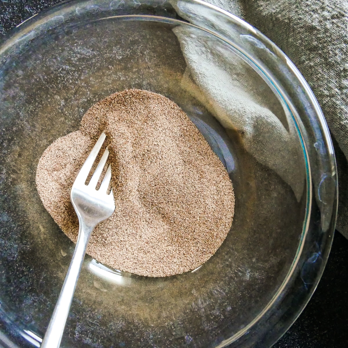 Cinnamon sugar mixture in a glass bowl.