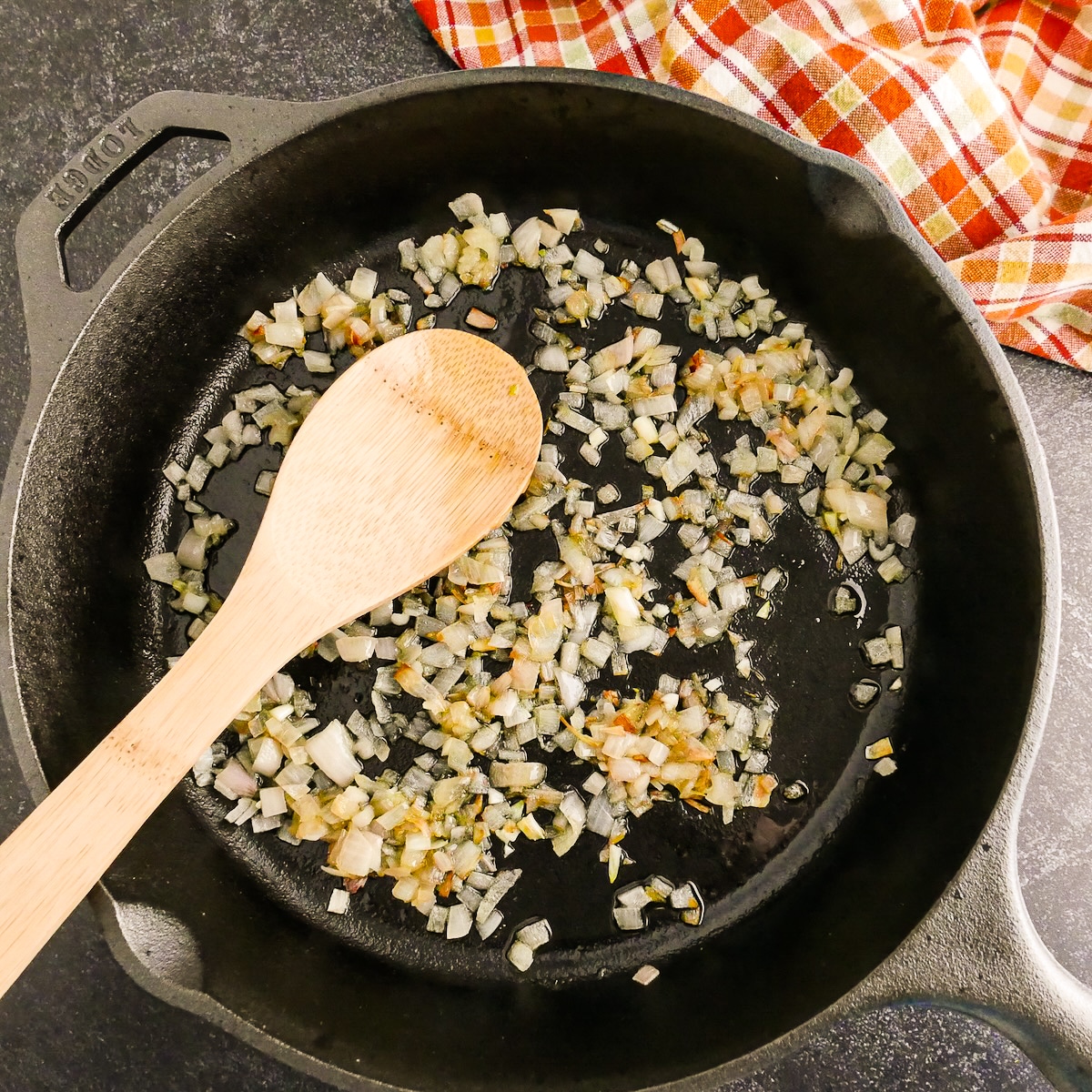 Cooking shallots and garlic in a cast iron skillet.