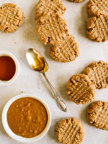 gluten free peanut butter cookies arranged on a baking sheet.