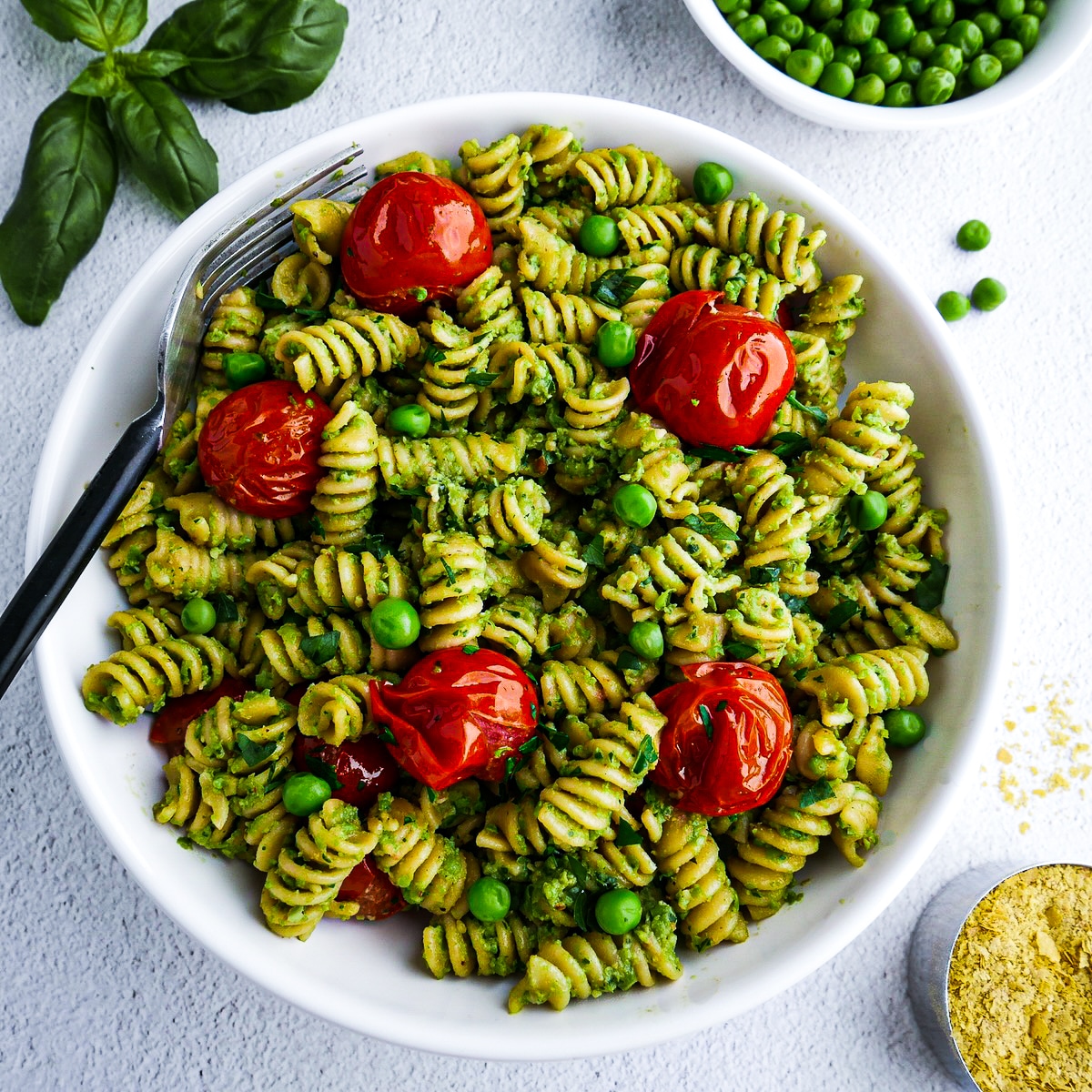 Creamy vegan pasta garnished with fresh parsley.