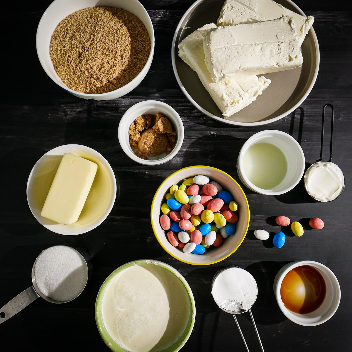 Cheesecake ingredients arranged on a table.