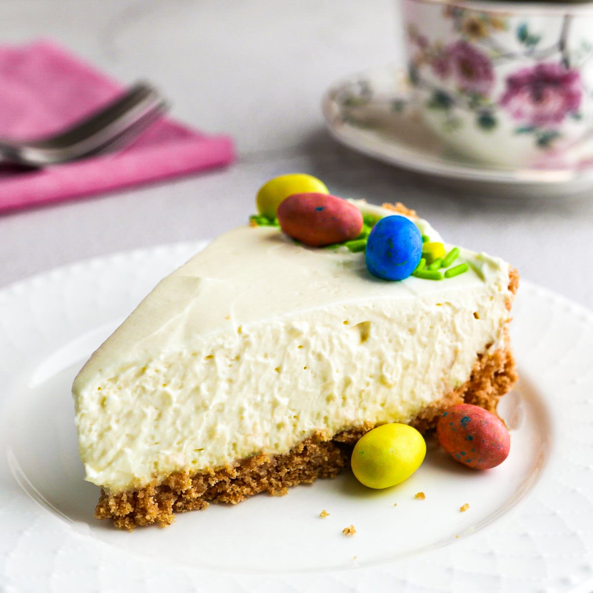 Slice of creamy no bake cheesecake arranged on a plate.