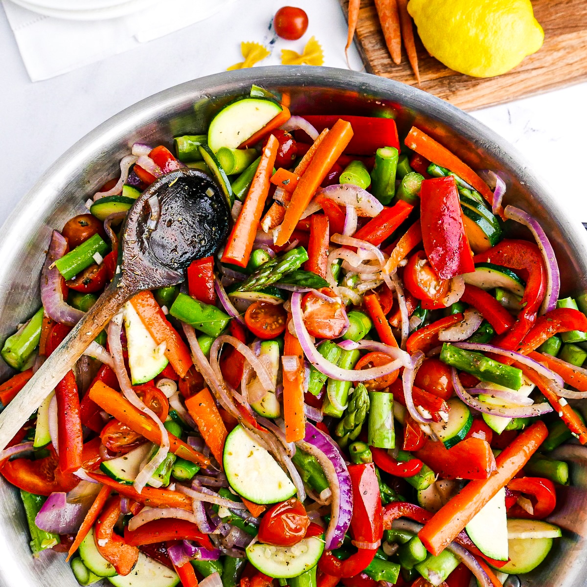 veggies-in-skillet.jpg Sliced zucchini, cherry tomatoes, and seasoning added to skillet.