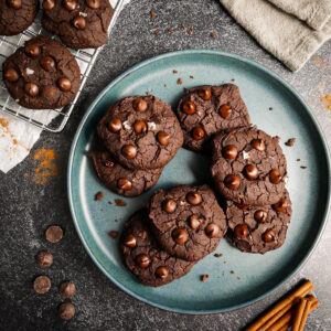 Fudgy black bean cookies arranged on a plate.