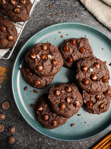 Fudgy black bean cookies arranged on a plate.